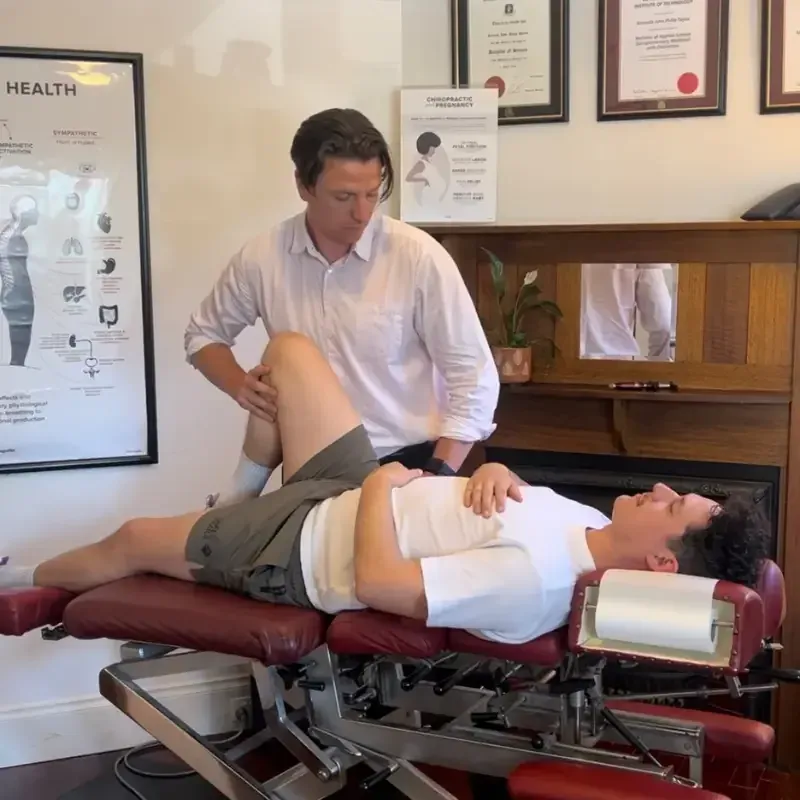 Dr Kenneth Taylor assessing a patient in the clinic