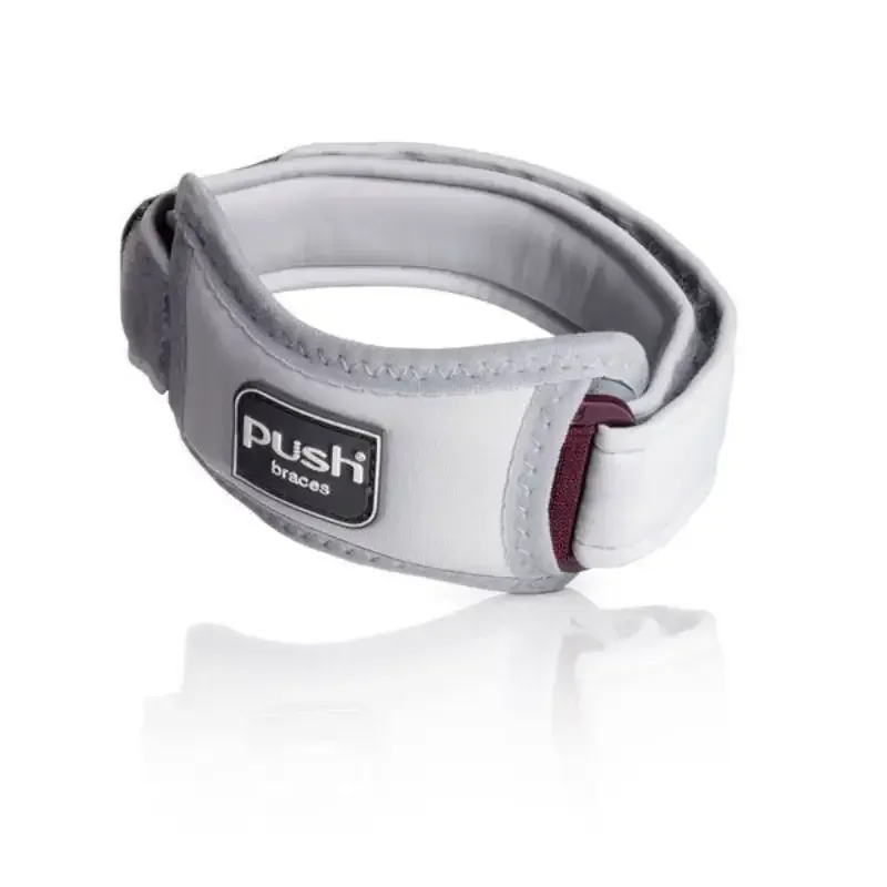 The Push med Patella Brace on its own, showing the strap and the pad