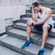 A runner on a path holding the front of their knee