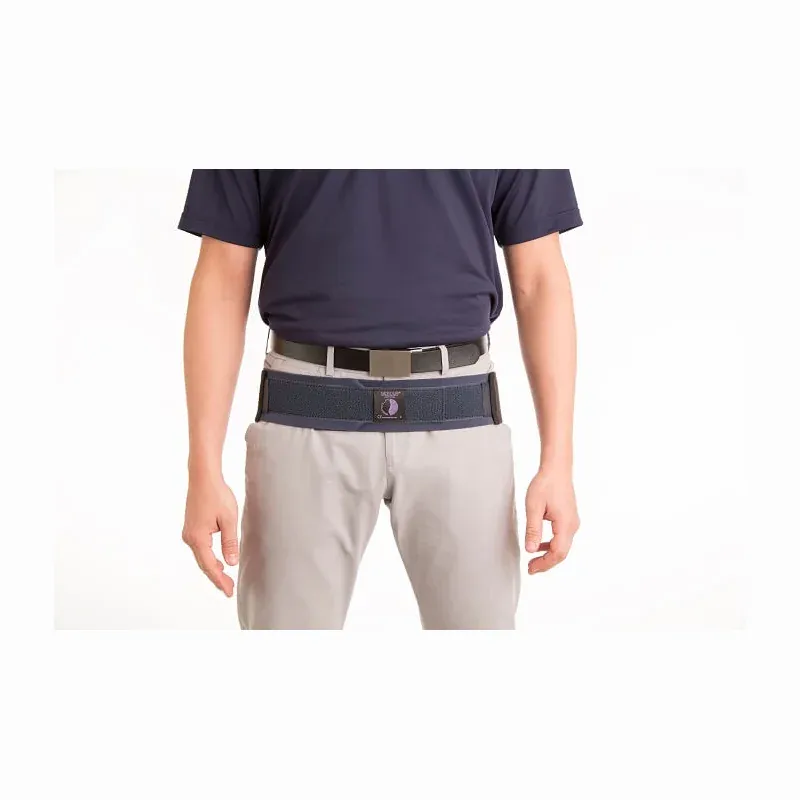 The belt worn over trousers at hip level, showing how little of it shows under clothing