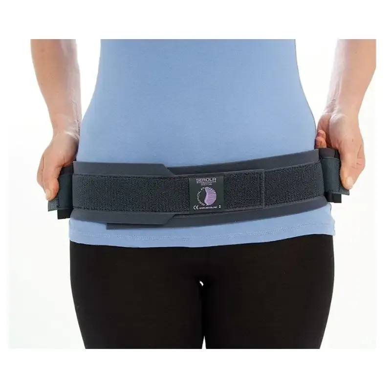 The belt worn over clothing, showing how low on the hips it sits and how the buckle is tensioned