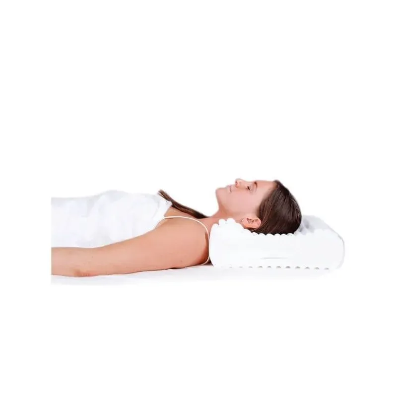 A woman lying on her back with her neck in the lower contour of the pillow