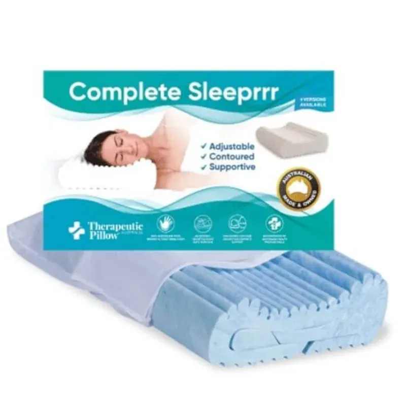 A contoured therapeutic pillow shaped to support the neck