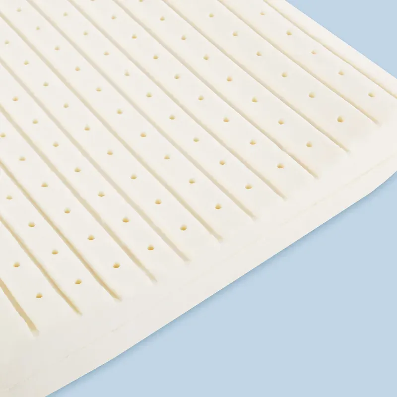 Close-up of the latex, showing the moulded channels and ventilation holes running through it