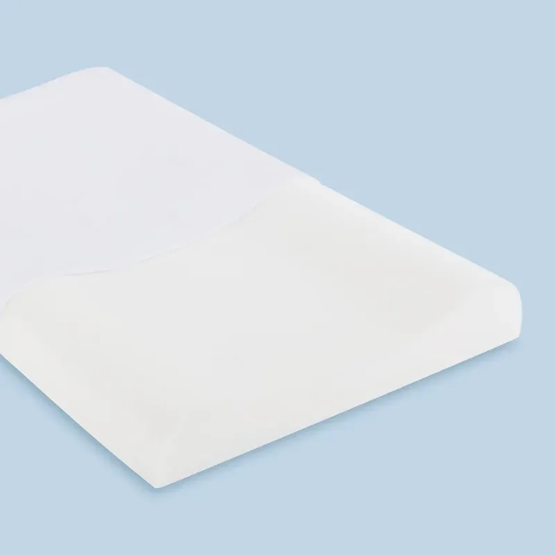 A low-profile contoured children's pillow with a white cotton cover