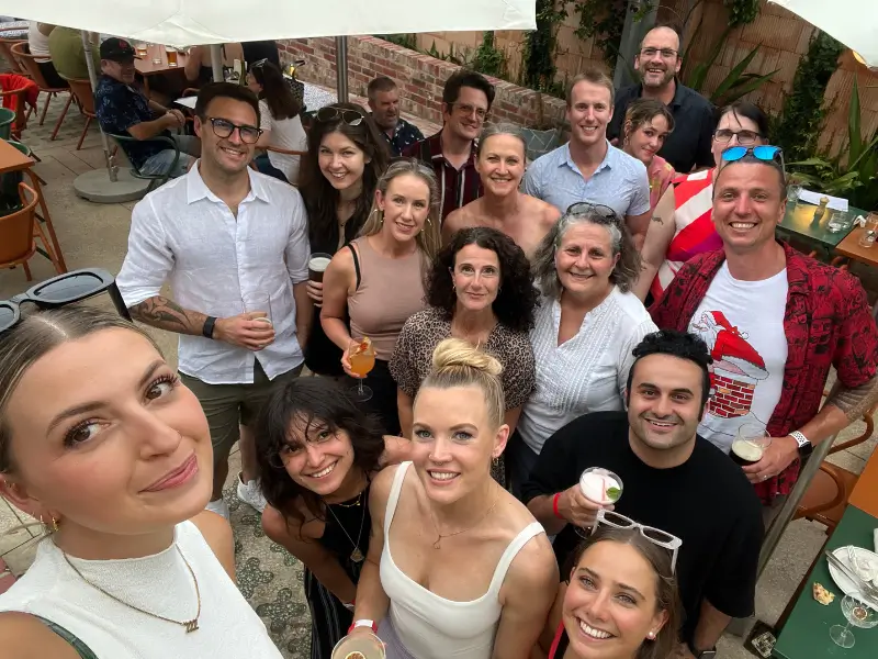 Group photo of the Brunswick Health team enjoying a social gathering outdoors.