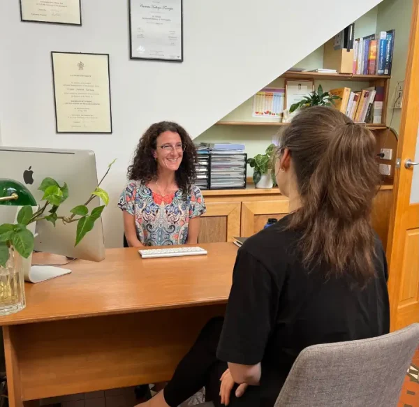 Carmen Farrugia, a fertility naturopath, consulting with a patient in her office.