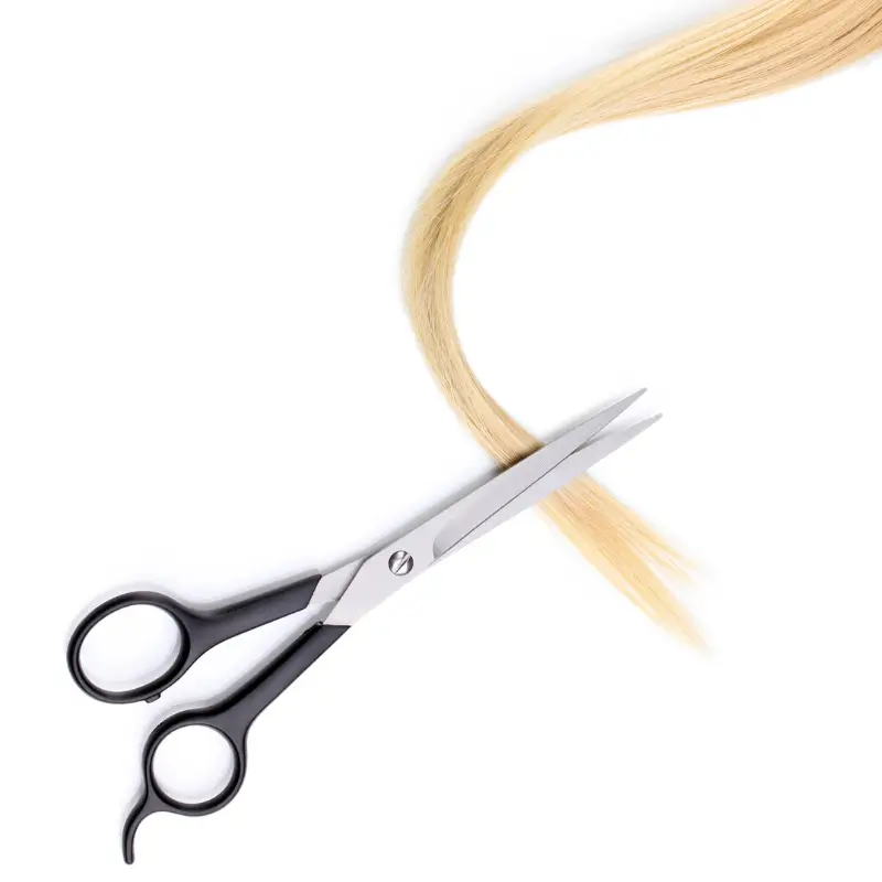 close-up image of scissors and cut hair strands of blonde hair representing hair mineral and toxic element testing