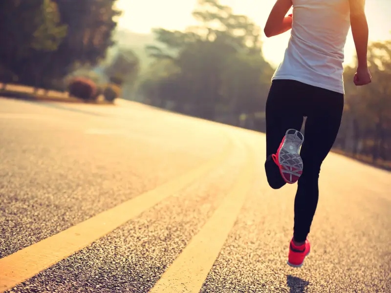 Runner on Road During Sunrise