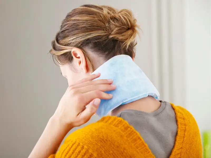 Applying Heat Pack for Neck Pain Relief