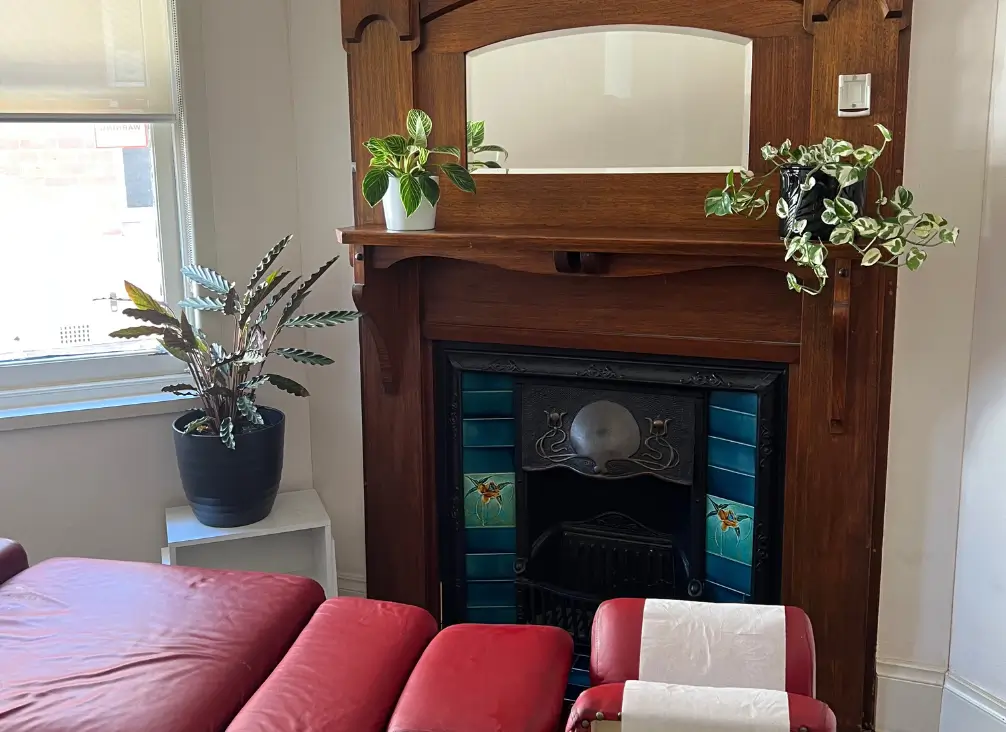 Chiropractic treatment room with heritage fireplace at Brunswick Health Hub